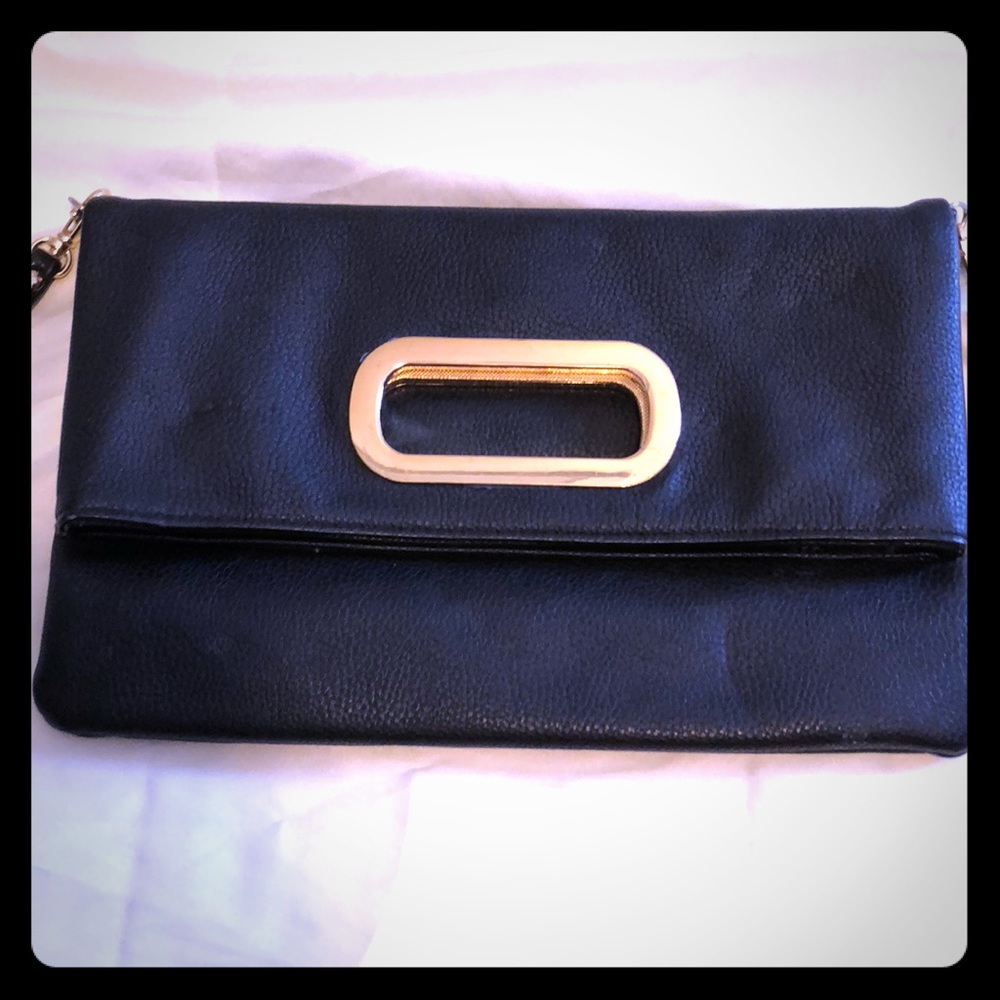 Aldo fold over black and gold clutch